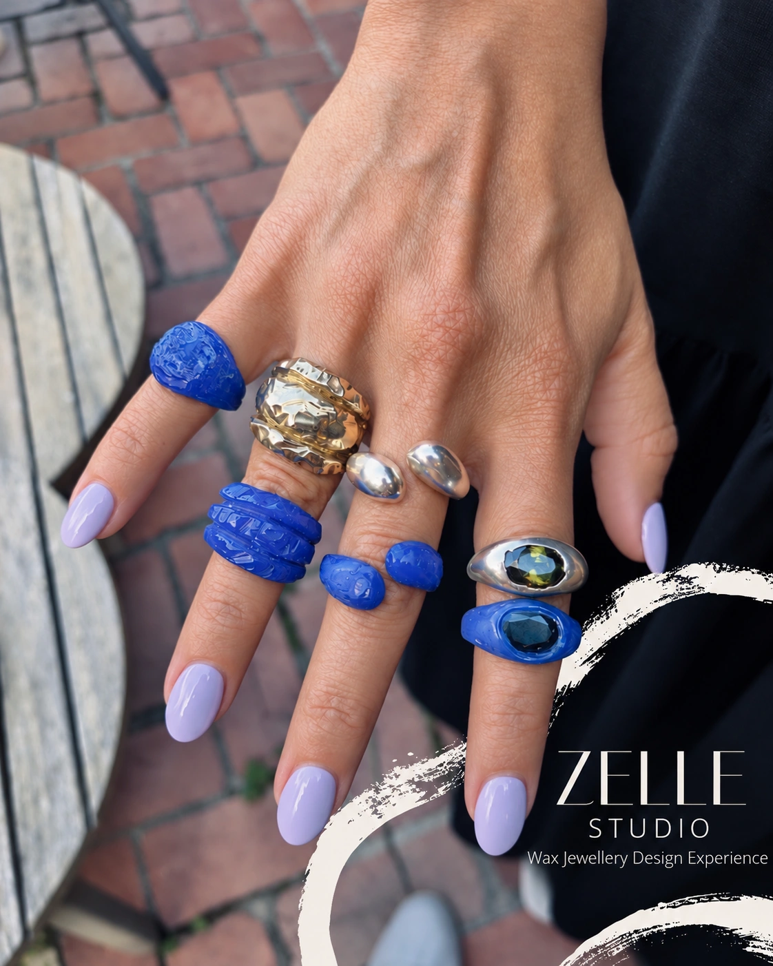Blue wax ring designs alongside finished silver rings